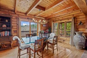 a dining room with a table and chairs at Ponderosa 1887 in Vilas
