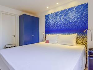 En eller flere senge i et værelse på Mercure Fortaleza Meireles