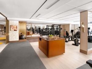 a fitness room with a gym with tread machines at Sofitel Montreal Golden Mile in Montréal