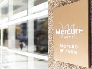 a sign on the side of a building at Mercure Sao Paulo Bela Vista in Sao Paulo