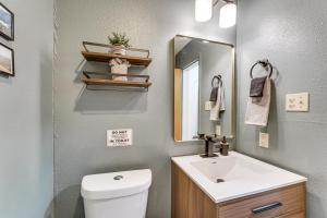 a bathroom with a white sink and a mirror at Easy Red River Ski Access! Outdoor Adventure Condo in Red River +16 photos