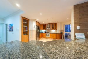a kitchen with a granite counter top in a room at Unit 1101 Oyster Rock in Durban