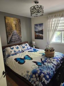 Ένα ή περισσότερα κρεβάτια σε δωμάτιο στο Le Robin des bois