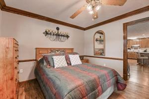 a bedroom with a bed and a ceiling fan at The Jordan View in Titus