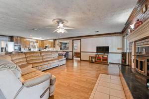a large living room with a couch and a tv at The Jordan View in Titus