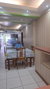 a dining room with tables and chairs at Litoral Palace Hotel in Belém