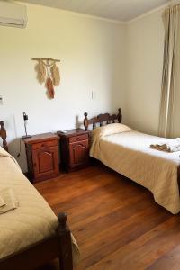 En eller flere senge i et værelse på Cabaña Sol de Otoño