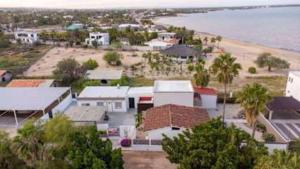 an aerial view of a town with a beach and houses at Beachfront Compound, Pool, BBQ, Best for Groups in Refugio