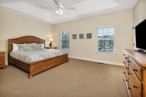 a bedroom with a bed and a flat screen tv at 402 Reserve Lane in Jewtown +29 photos