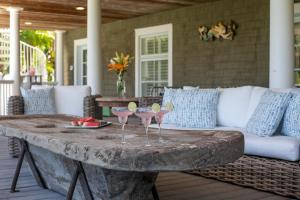 a stone table with wine glasses on a patio at 4201 Tenth Street in Saint Simons