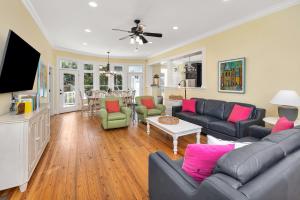a living room with a couch and a tv at 4205 Ninth Street in Saint Simons Island
