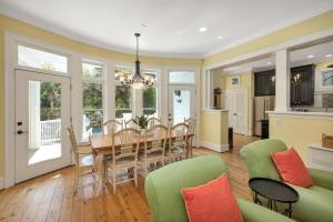 a dining room and kitchen with a table and chairs at 4205 Ninth Street in Saint Simons Island