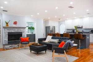 a living room with a couch and a fireplace at 617 Neptune Way in Demere Park