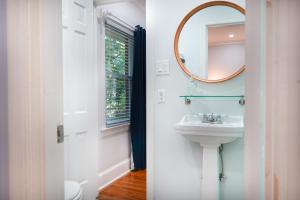 a bathroom with a sink and a mirror at 617 Neptune Way in Demere Park +35 photos