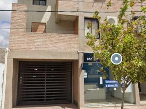 a building with a garage door in front of it at Cordon del Velazco LR in La Rioja