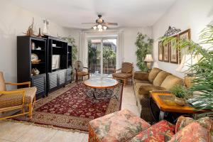 a living room with a couch and a table at 760 Ocean Blvd #204 in Saint Simons