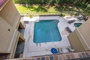 an overhead view of an empty swimming pool at 760 Ocean Blvd #204 in Saint Simons