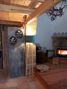 a living room with a couch and a fireplace at Traditionelles Dorfhaus Malona in Malona Village