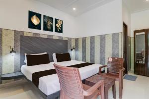 Postel nebo postele na pokoji v ubytování Hotel O Vivanta Resorts