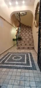a stairway with a mosaic tile floor and a staircase at Taksim Şato Hotel in Istanbul