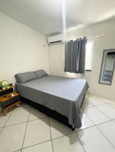 Ένα ή περισσότερα κρεβάτια σε δωμάτιο στο Apartamento completo e central! Casa Caju! +4 φωτογραφίες