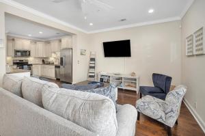 a living room with a couch and two chairs at 1204 Reserve Lane in Jewtown