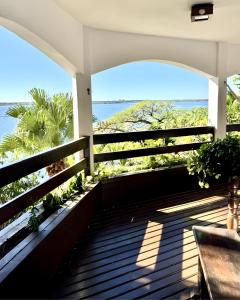 a porch with a view of the ocean at Villa Colosseum in Florianópolis +19 photos