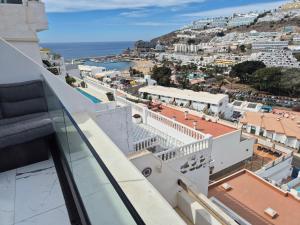 a view of the city from the balcony at Leopard Rock E4 Puerto Rico Views in Puerto Rico de Gran Canaria