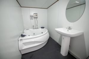 a bathroom with a sink and a toilet and a mirror at 360องศาเขาค้อ in Ban Thung Samo