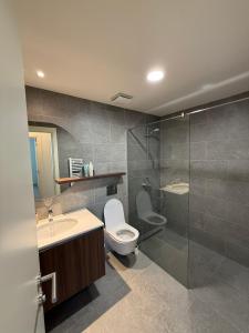 a bathroom with a toilet and a sink and a shower at BelgradeWATERFRONT - Apartments in Sajmište