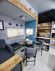 a living room with a couch and a table at Shroom life farm Chicken shack in North Fort Myers