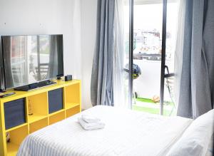 En eller flere senge i et værelse på Apartamento com terraço em Lisboa