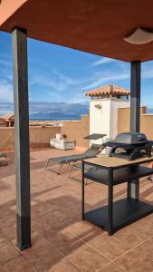 a group of tables sitting on top of a roof at Casa Kusama in Corralejo
