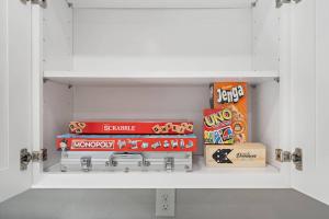a white shelf with some snacks on it at Nr Med Center, Museum Wifi Games Bbq Fire Pit in Houston
