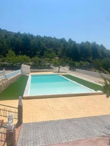 an empty swimming pool in a yard at Estudio Finca Mas el Bravo in Caudiel