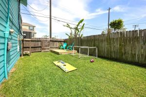 a backyard with a soccer field and a goal at Cozy Home Nr Beach Pier Games Wifi Yard Bbq in Galveston