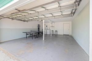 an empty room with a table and chairs in it at Cozy Home Nr Beach Pier Games Wifi Yard Bbq in Galveston