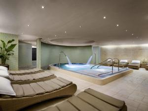 a hotel room with a large swimming pool at Sofitel London Heathrow in Hillingdon