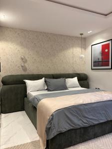 Ένα ή περισσότερα κρεβάτια σε δωμάτιο στο Exclusive London Apartments +3 φωτογραφίες