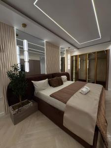 Ένα ή περισσότερα κρεβάτια σε δωμάτιο στο Exclusive London Apartments