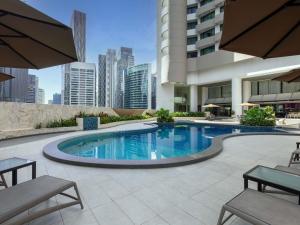 a swimming pool in the middle of a building at Novotel Kuala Lumpur City Centre in Kuala Lumpur