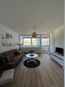 a living room with a couch and a table at Christine's Apt.115 in Sonthofen