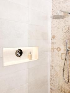 a bathroom with a shower with a sink at Casa Puerta del Valle in Belalcázar +31 photos