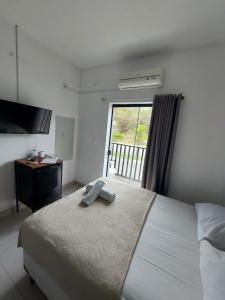 Postel nebo postele na pokoji v ubytování Pousada das Flores + 29 fotografií