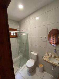 a bathroom with a toilet and a shower and a sink at Bio-Resort Brasilien in Trairi