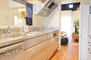 a kitchen with a sink and a counter top at I will meet Hyakuna, - Vacation STAY 33599v in Nanjo +31 photos
