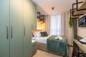 Postel nebo postele na pokoji v ubytování All Batel - Suyts