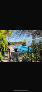 a view of a swimming pool with trees and plants at Hotel Pilar in Pilar