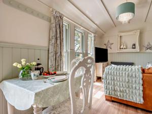 a dining room with a table and a chair at 1 Bed in Boscastle 95316 in Camelford