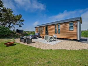 a tiny house with a patio and a yard at 1 Bed in Boscastle 95316 in Camelford